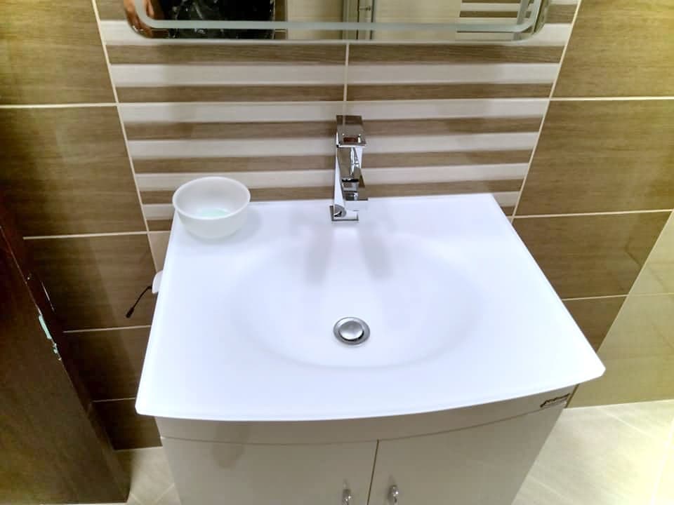 Beige and brown bathroom with a shower enclosure — Vanity unit