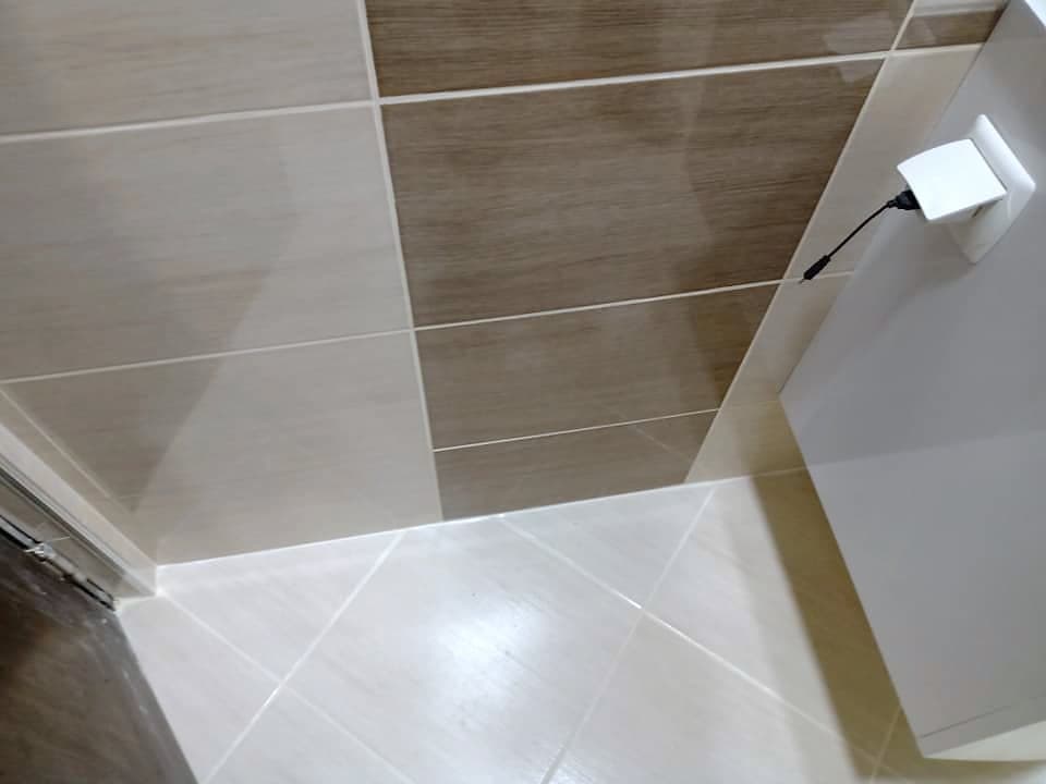 Beige and brown bathroom with a shower enclosure — Beige and brown tiles