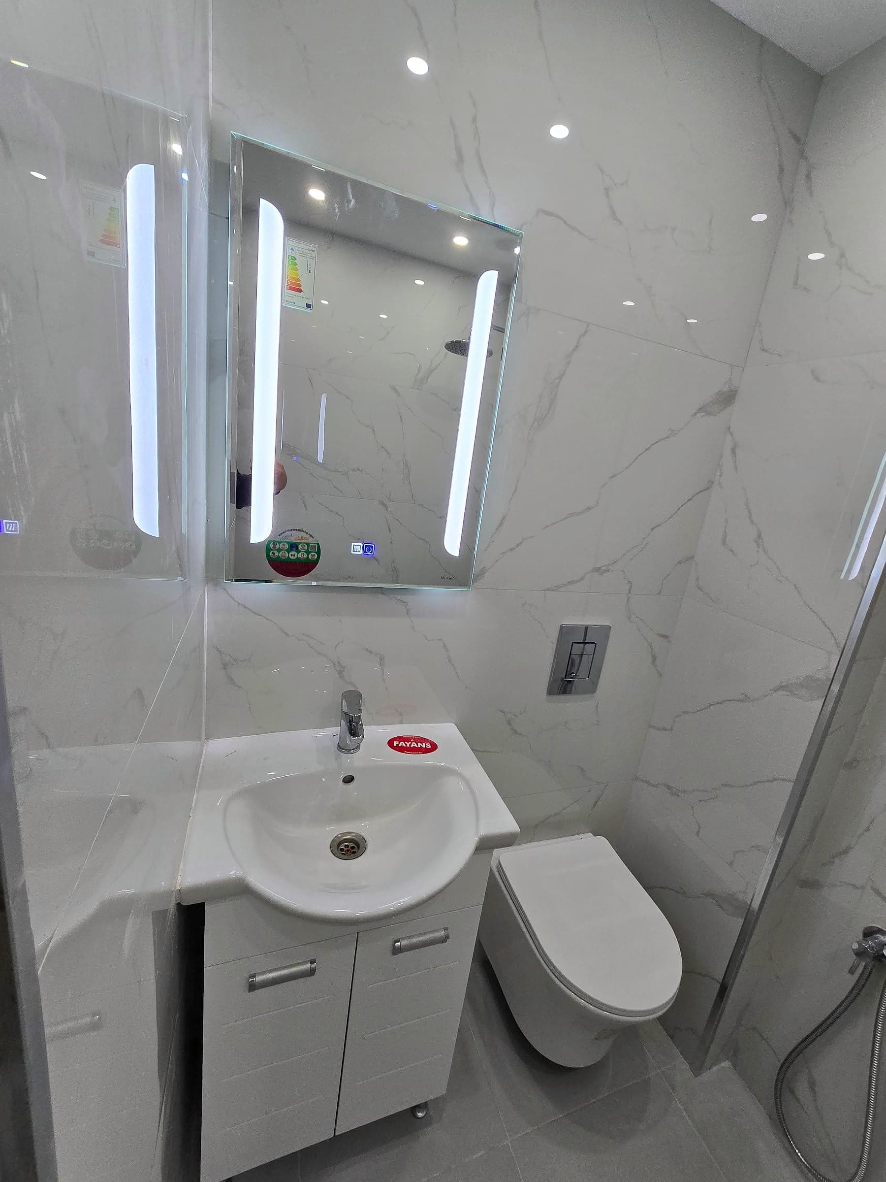 Bathroom in Gotse Delchev: white marble and an LED mirror — LED mirror