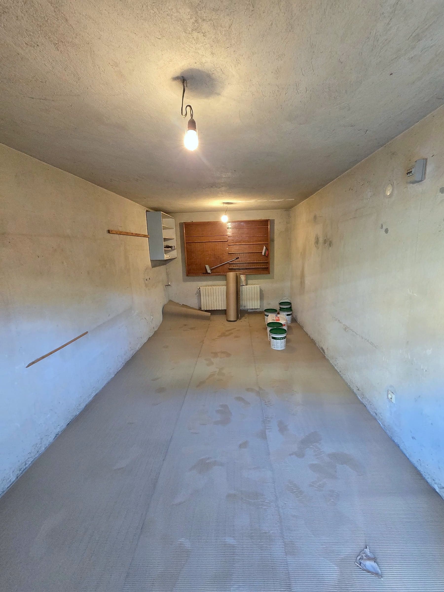 Garage in Mladost: skim coat, paint and a sink — The garage before and after the renovation