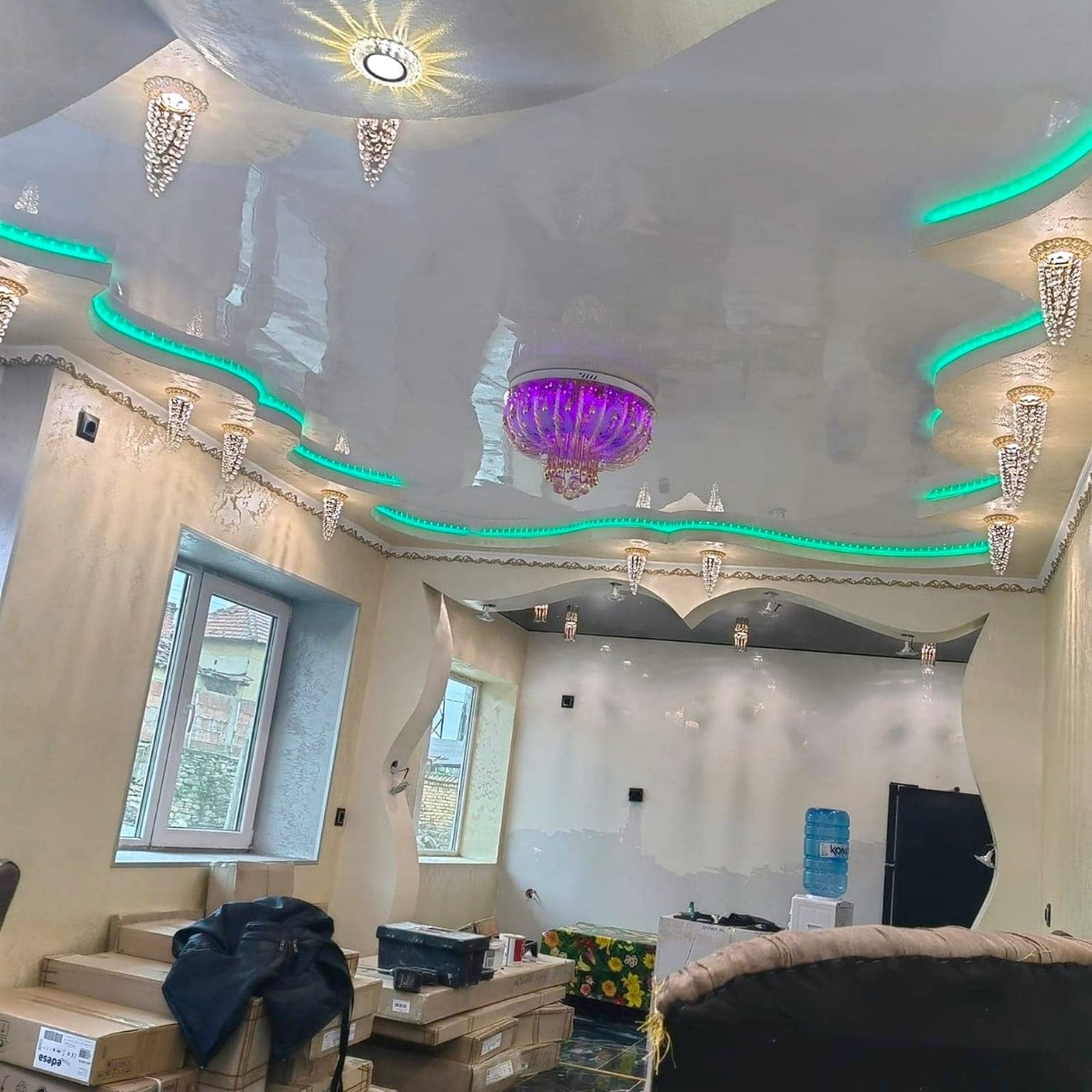 House with decorative ceilings, walls and arches — Glossy ceiling with LED lighting and crystal light fittings