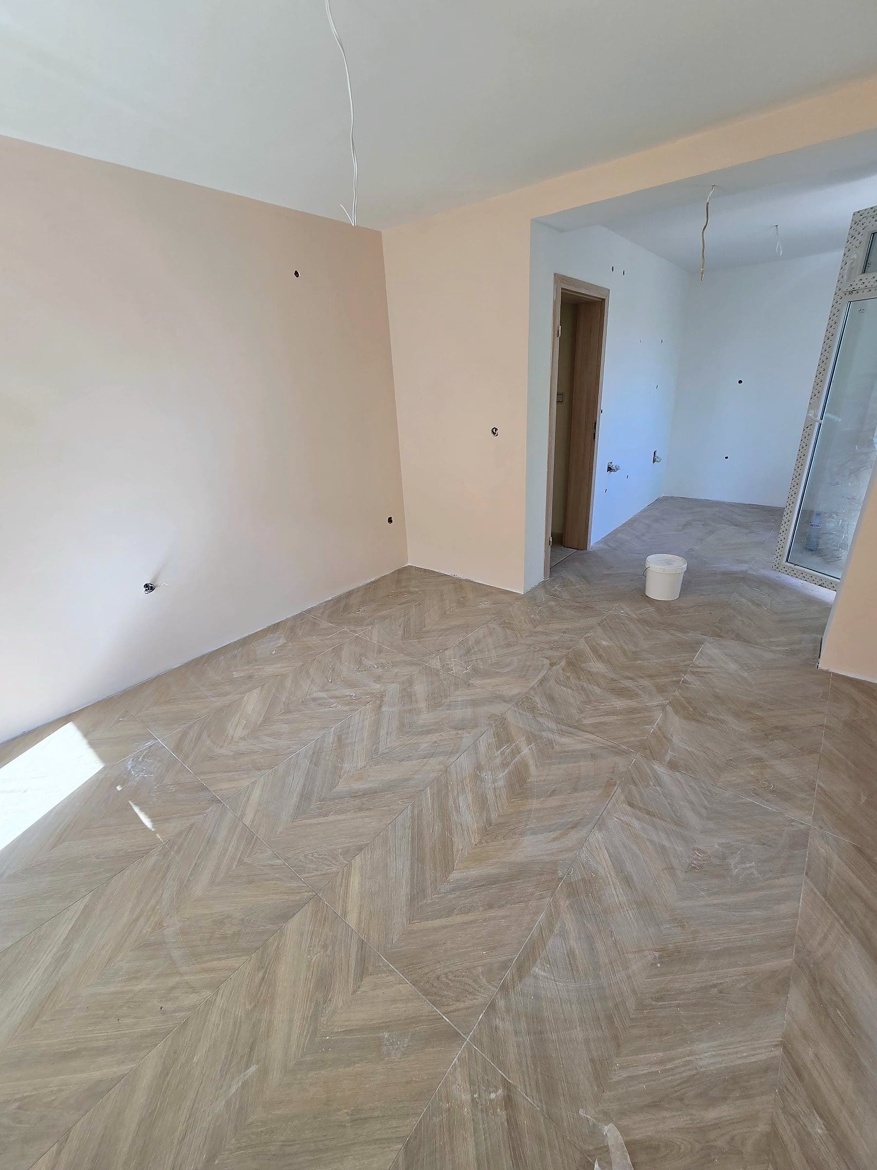 House in Bankya: skim coat, paint and a herringbone floor — Flooring laid in a herringbone pattern