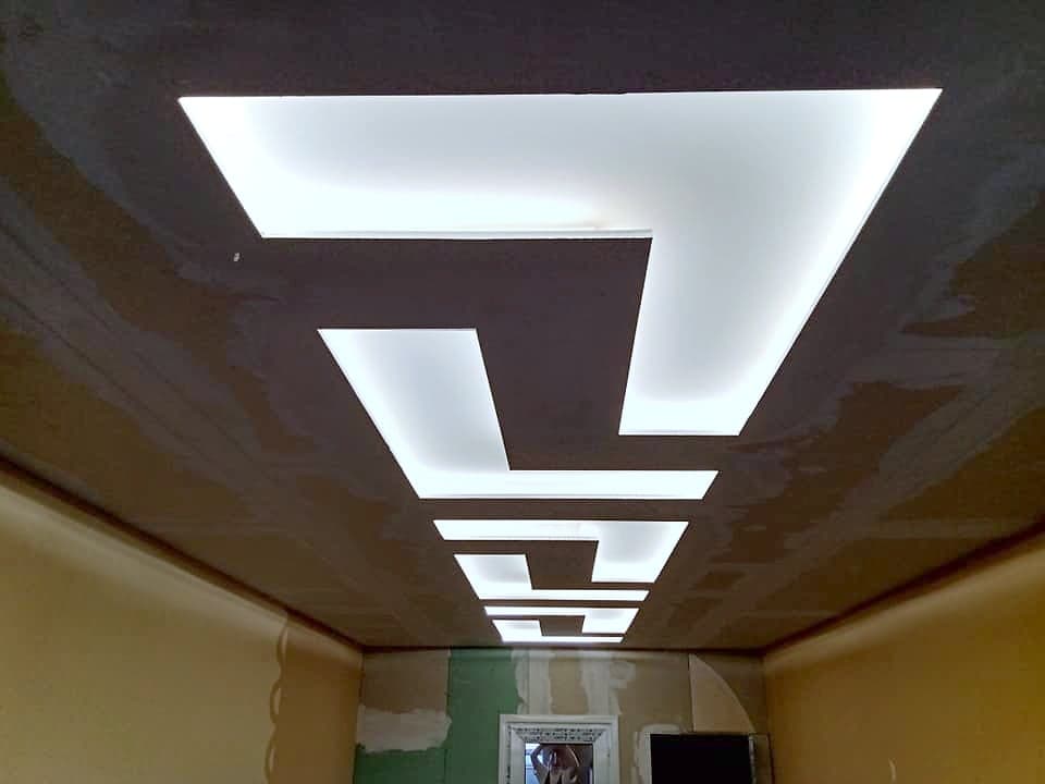 Ceiling with geometric LED lighting — The ceiling with the lighting on